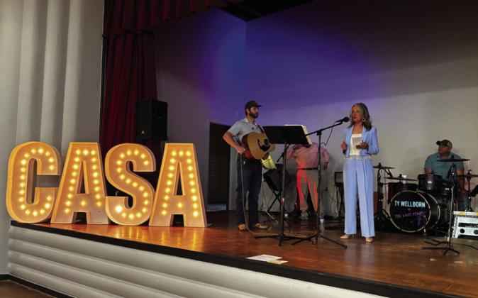Court Appointed Special Advocates (CASA) of the Rolling Plains Board Member Lisa Manuel introduces Ty Wellborn and the Last Stand, welcoming the crowd to the 2024 gala fundraiser event in the ballroom of the Bura Handley Community Center in Wellington. Photo Courtesy of CASA of the Rolling Plains