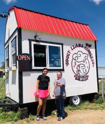 Open 5:30 a.m.-2 p.m. Monday-Friday and 7 a.m.-2 p.m. Sunday, baristas Mallory O’Rear, left, and Abigail Hernandez serve a Sorensen Wellhouse customer a Tiger Pride, an iced coffee signature drink, last Monday afternoon. Also known as The Soggy Llama, watch for the bright, red tin roof on the west side of U.S. Hwy 83. Coffee orders can be called in to the temporary number, 806-676-2644.