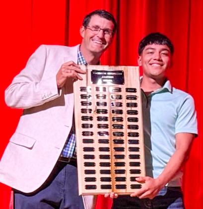 During the 6:30 p.m. Monday, May 11 Wellington High School (WHS) All-Sports Banquet at the WHS Auditorium, students received recognition for an outstanding year of Skyrocket athletics. Wellington High School senior Gustavo Soto receives the Football Defensive Lineman Award, presented by Athletic Director Greg Proffitt. SHAUNA SALINAS/THE GREENBELT INTREPID