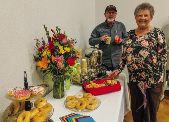 J.D. Hamby and Fraya Hammons partake in the donuts and coffee during their tour of the new Wellington Senior Citizen Center.