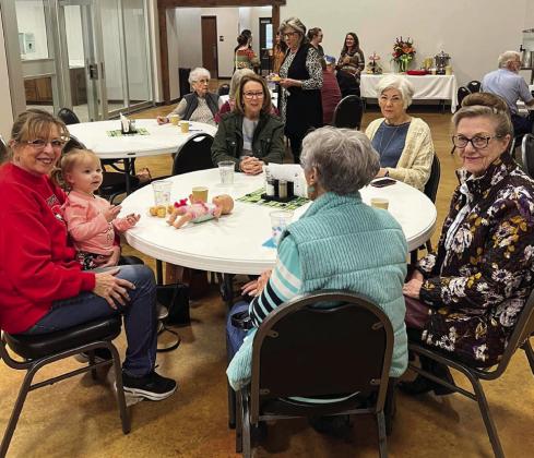 Visitors enjoying the Open House fellowship at the Wellington Senior Citizen Center include, clockwise from left, Lennie Statham with granddaughter Kynleigh Statham, Dian Souder, Linda Powell, Sharon Starkey and Fran Eigenmann. Courtesy Photo: