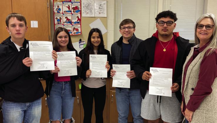 Childress High School students Creed Lane, left, Katie Bachausen, Angelic Torres, Josiah Roark and Adrian Macias receive their Food Handlers certification from Childress County Extension Agent Dawn Dockter, who presented AgriLife Extension’s Food Safety course, as well as proctored the state-approved exam. The students thank Childress Veterinary Hospital’s Dr. David Fuston and Nancy Fuston, who sponsored the students’ exam fees.