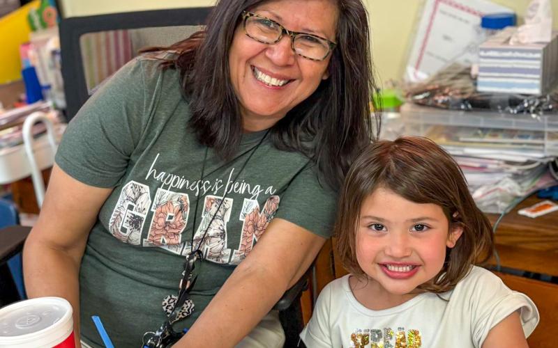 Austin Elementary School first-grade student Astrid Benetiz cashes in her Classroom Hero points to have lunch with her teacher, Norma Ross. MEMPHIS ISD