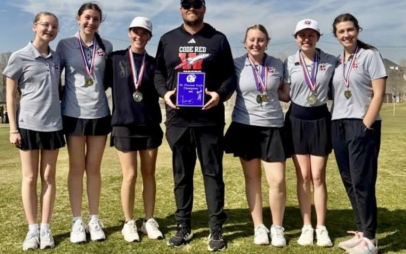 The Wellington Lady Rocket golf team puts on an impressive performance Monday, March 2, finishing as the first-place team at the AA-Regional Preview at Palo Duro Creek Golf Course in Canyon. They also came home with a first-place medal by Allie Duncan, a secondplace medal by Maggie Tillman and a sixth-place medal by Elli Ouellette. From left: Hartley Kane, Anna Dwyer, Tillman, Coach Klark Ashmore, Duncan, Ouellette, Brynlee Proffitt. Wellington High School