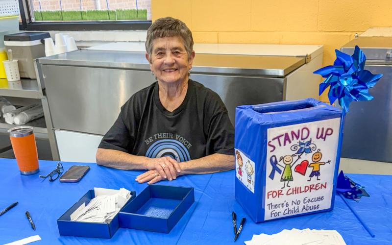 Saunna Blacksher, a longtime member of Collingsworth County Child Welfare Board, supporting Child Protective Services (CPS), registers parents during the annual “Eat Lunch with Your Child” event on Thursday, April 2 at the Wellington Elementary School cafeteria. Parents eating with their child entered their name in a drawing for gift cards to area restaurants and Market Square Supermarkets. Watch for winners in next week’s edition of The Red River Sun.