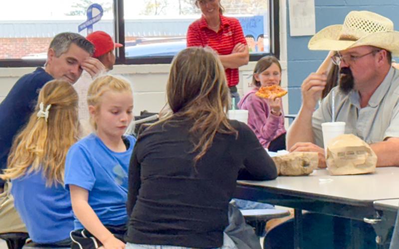 Parents crowd into the Wellington Elementary School cafeteria for the Thursday, April 2 “Each Lunch with Your Child” campaign to publicize Child Abuse Prevention Awareness during the month of April.