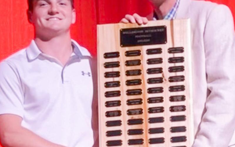 Wellington High School junior Connor Bowen receives the Football Defensive Linebacker Award, presented by Athletic Director Greg Proffitt.