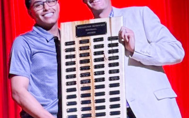Wellington High School senior Yobani Moreno earns the Football Outstanding Lineman Award, presented by Athletic Director Greg Proffitt. SHAUNA SALINAS/THE GREENBELT INTREPID
