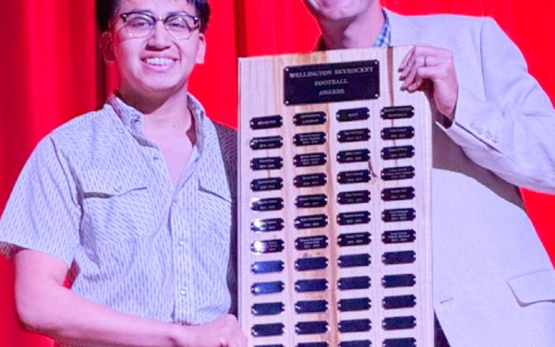 Wellington High School senior Joey Orozco garners the Football Larry Wright Memorial Award, presented by Athletic Director Greg Proffitt.