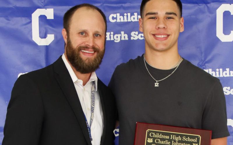 Jacob Mora receives the Charlie Johnston Team Most Valuable Player Award, presented by Athletic Director Bo Helm.