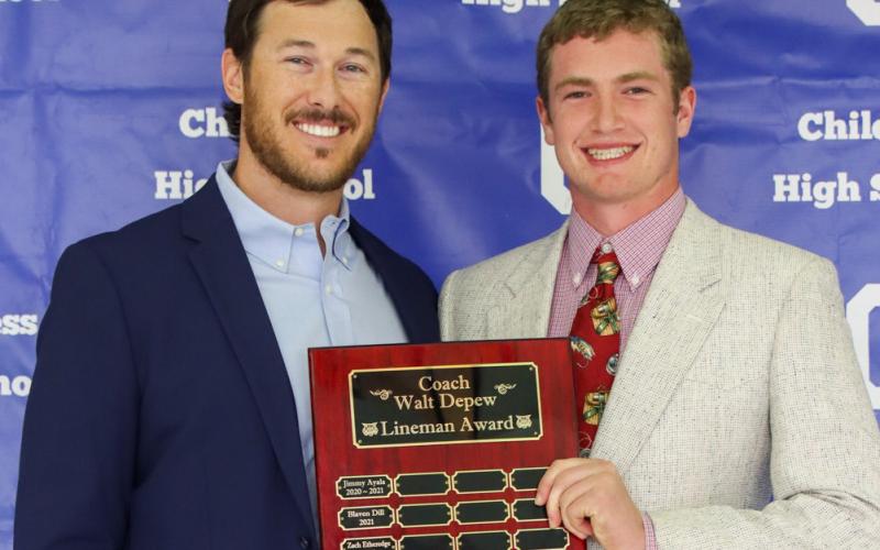 Cutter Bruce receives the Coach Walt Depew Lineman Award, presented by Offensive Coordinator Reid Ware.