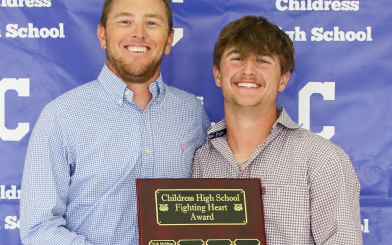 Corbyn Taylor receives the Fighting Heart Award, presented by Coach Brady Blake.