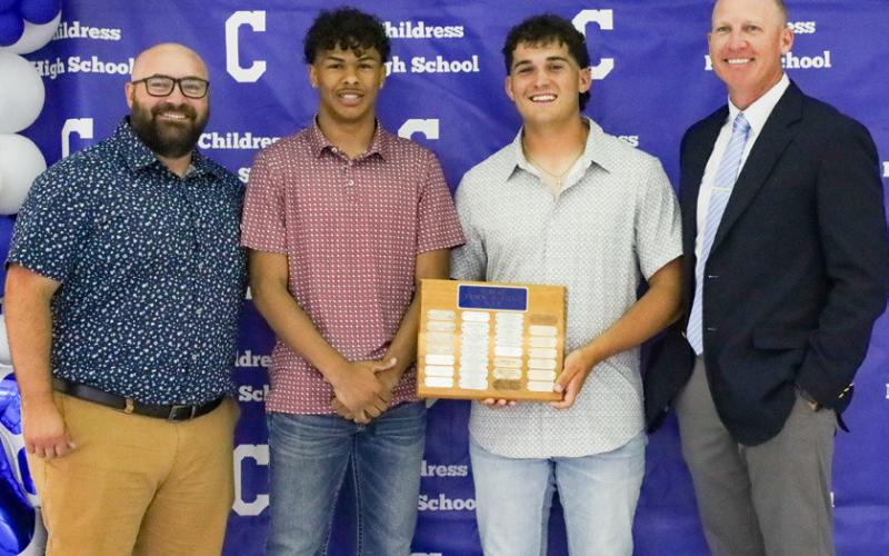 Jaden Walker receives the Bobcat Track Most Valuable Player Award, and Colton Teichelman receives the Bobcat Field Most Valuable Player Award, presented by Coaches Lee Brandon and Kolby Pool. From left: Pool, Walker, Teichelman, Brandon.