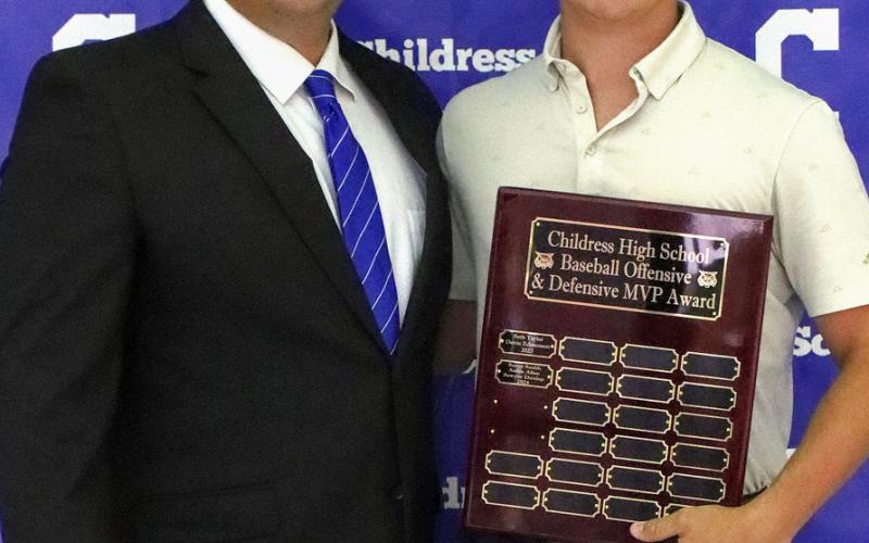 Noah Ellerbrook receives the Bobcat Baseball Fighting Heart Award, presented by Bobcat Head Baseball Coach Trent Mayden.
