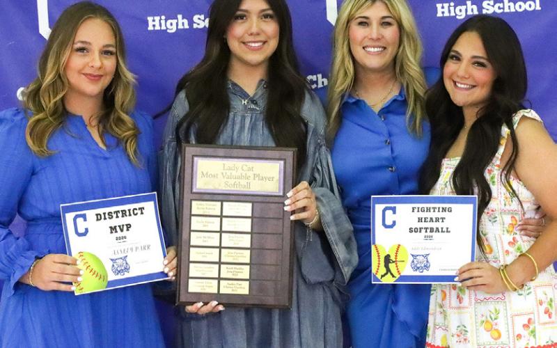 Journey Prince receives the Lady Cat Softball Offensive Most Valuable Player Award (MVP), Ansley Parr receives the Lady Cat Softball Defensive MVP Award and Addi Edmondson receives the Fighting Heart Award, presented by Lady Cat Head Softball Coach Charlsi Bozeman. From left: Parr, Prince, Bozeman, Edmondson.