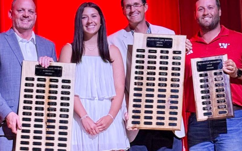 Wellington High School Senior Brynlee Proffitt receives the Girls’ Basketball Offensive Award, presented by Coach Shannon Fisher, the Girls’ Track Field Event Award, presented by Athletic Director Coach Greg Proffitt, and the Girls’ Golf Most Valuable Player Award, presented by Coach Klark Ashmore.