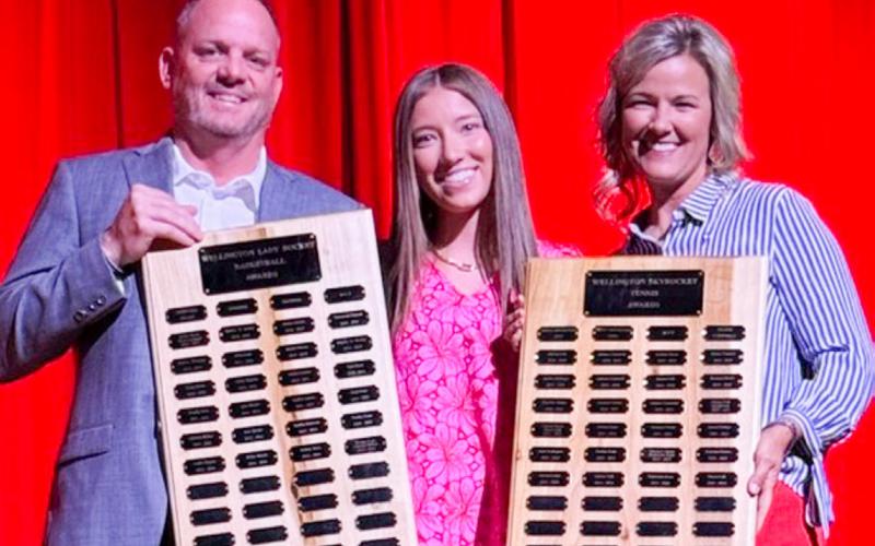 Wellington High School Senior Brynlee Phillips garners the Girls’ Basketball Defensive Award, presented by Coach Shannon Fisher, and the Tennis Most Valuable Player Award, presented by Coach Amy Inman.
