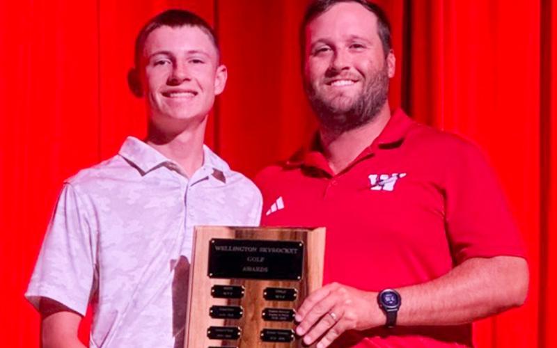 Wellington High School Junior Carter Ouellette garners the Boys’ Golf Most Valuable Player Award, presented by Coach Klark Ashmore.