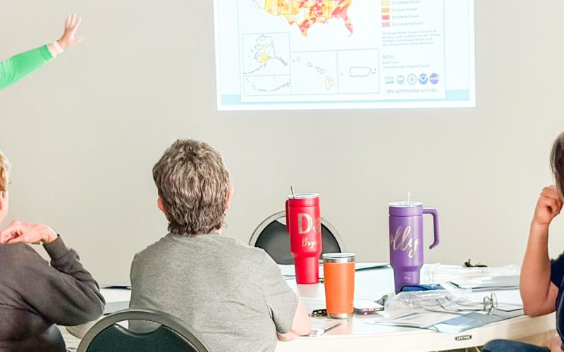 Jennifer Puryear, a meteorologist with RMBJ Geo, Inc., describes the 2026 drought monitor data to the attendees at the recent Rainwater Harvesting Workshop in Wellington. BEV ODOM/THE GREENBELT INTREPID