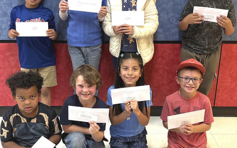 Wellington students accept lunch with parents cards