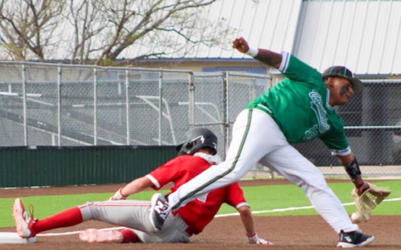 On the road again, Wellington sophomore Jax Heflin slides into third base as the Skyrockets are downed by the Floydada Whirlwinds, 13-8, Tuesday, April 14.