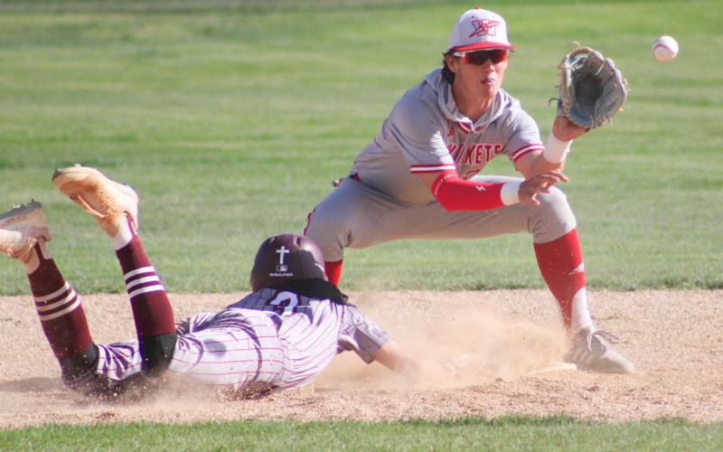 Wellington’s Lawson Inman attempts to out a Clarendon Bronco during the Skyrockets’ 4-3 fall Tuesday, April 21.