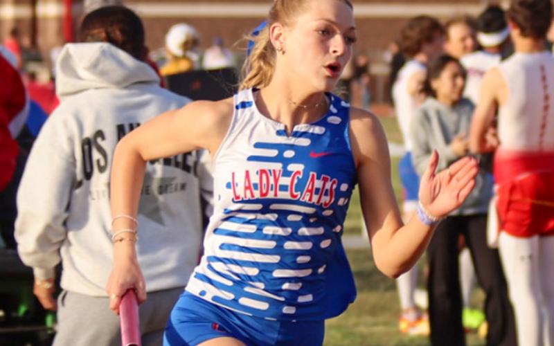 Childress’ Auburn Green aids the Lady Cats in first-place finishes in the 4x100-, 4x200- and 4x400-meter relays during the Rocket Relays Thursday, March 12 in Wellington. Childress High School Yearbook