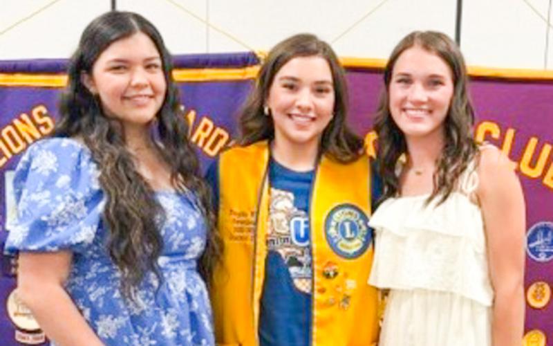 Wellington High School (WHS) junior Kaycee Martinez, left, will reign as Wellington Lions Club’s new 2026-2027 Sweetheart. Members selected Martinez during the Monday, May 4 meeting, where junior Maggie Tillman, right, also competed for the honor. Each candidate addressed the Lions and described their involvement in school activities and passion for community service. The 2025-2026 Sweetheart, Treylea Wiebe, congratulates both candidates. BEV ODOM/THE GREENBELT INTREPID