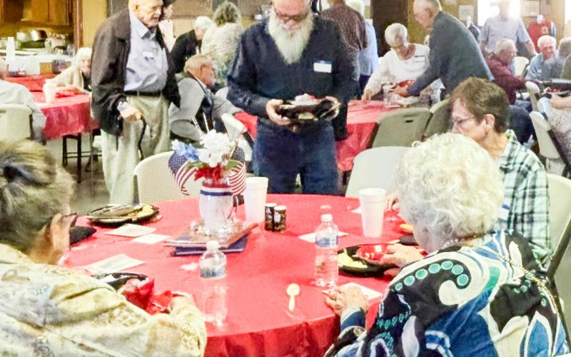 Folks embrace the fellowship during the Saturday evening, April 4 Quail Ex-Student Reunion at the Quail Community Building. Clockwise, from left: guest Sharon Starkey, of Wellington; Troy Harrison, of Amarillo; Bobby and Anita Dodez, of Texarkana; Vada Bell Wood, of Wellington. COURTESY PHOTO