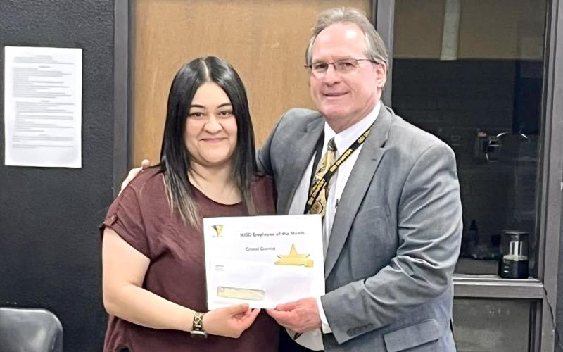 Memphis Independent School District (ISD) Superintendent William Alexander congratulates March Employee of the Month Cristal Garcia, an instructional assistant at Memphis Middle School. “These ladies show up each day to help our students grow,” Alexander said, and they make sure our kiddos know hwo much they matter.” The Memphis ISD Employee of the Month Program is sponsored by Memphis First Bank and Trust. Memphis ISD