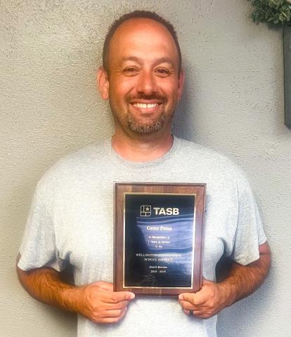 Wellington Independent School District (ISD) Trustee Gene Pena accepts a plaque for seven years of service, 2019-2026. On behalf of Texas Association of School Boards (TASB), Wellington ISD Superintendent Kurt Ashmore made the presentation during the Monday, April 13 meeting. Pena did not seek reelection for another term. WELLINGTON ISD