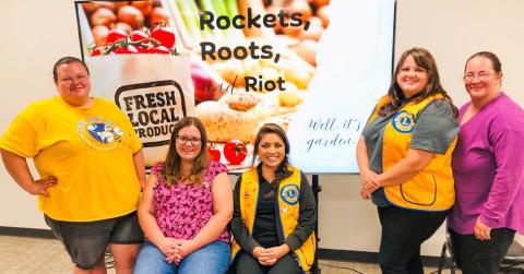 Lion Lindsay Hill, left, is joined by a group of women who have designed a plan for a community garden, including Jaci Roberson, Lion Noemi Pena, Lion Kassidy Barlow and Katy Sorenson. The Rockets, Roots and Riot PowerPoint presentation described the components of the project during the Monday, Aug. 18 meeting of the Wellington Lions Club. The Red River Sun/Bev Odom