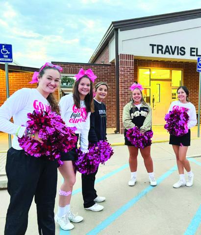 Cyclone cheerleaders greet Travis Elementary students