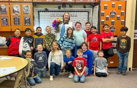 Childress Elementary School second-grade teacher Heather Overmiller, surrounded by her students, accepts Childress Elementary Teacher of the Year. Photos Courtesy of Childress Elementary School