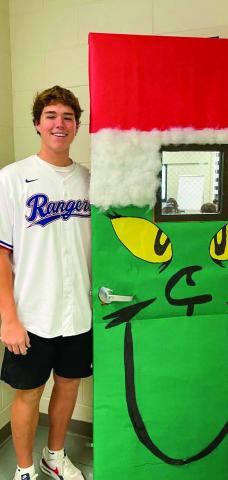 Childress High School (CHS) Family, Career and Community Leaders of America (FCCLA) members, including sophomore Kaleb Mayden, festively decorate the classroom doors of CHS. Photos Courtesy of Childress High School