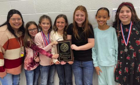 Katelynn Molina, Wellington Elementary School fourth-grade teacher, congratulates her students for their December District UIL Academic Meet achievements. From left: Molina, Briley Holton, Peyton Roberson, Raylie Sims, Piper Barnes, Alaeja Archie and Callahan Cantu. Photos Courtesy of Wellington Elementary School