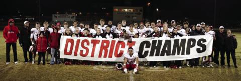 The Wellington Skyrockets display their District 2-2A Division II Championship trophy on a chilly Friday, Nov. 4 following a 44-8 win against the Clarendon Broncos. Lukas Wilbur Photography
