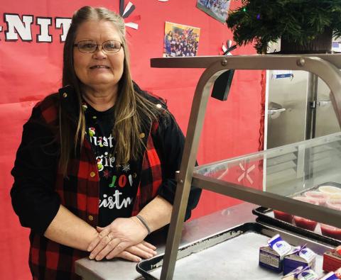 Georgia Brown serves her final meal for Wellington students in the school cafeteria Thursday morning, Dec. 21. The Red River Sun/Bev Odom