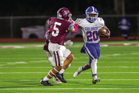 Childress running back Dareon Mathis (20) gains yardage for the Bobcats while warding off Tulia defensive back Timmy Trevino (5) Friday, Oct. 14 at Younger Field. The Red River Sun/Nicole Dill