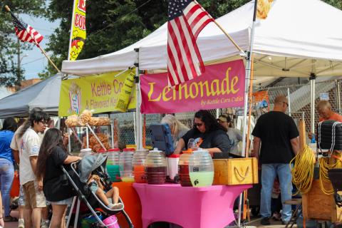 Attendees shop over 40 vendor booths, including Kettle Corn Cuties, during the 90th Annual Hall County Picnic Saturday, Sept. 20 in downtown Memphis. 