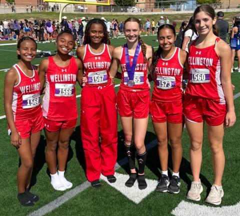 Wellington High School sophomore Taytum Kane continues the Kane family winning tradition, placing ninth in the 1A-4A division Saturday, Sept. 20 at the Canyon Cross Country Invitational at Canyon High School, clocking a personal record of 12:12.96. From left: Kobee Lewis, Aleah Lewis, Angela Lewis, Kane, Sabrina Segovia, Anna Henard.  