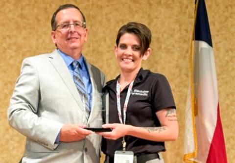 Presented by Director of Operations Howard Heath of the Panhandle Regional Advisory Council (P-RAC), Wellington Emergency Medical Services Administrator Samantha “Sam” Blacksher accepts the Texas Panhandle EMS Professional of the Year honor on Thursday, Sept. 18 at Amarillo Civic Center.A graduate of Samnorwood High School, Blacksher obtained her nursing degree at Clarendon College. 