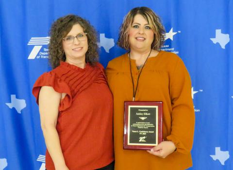 Ashley Elliott, Construction Recordkeeper at the Childress Area Office, is presented with the Vance L. “Huck” Castleberry award. Elliott, right, began her career at TxDOT in 2020 as an HR Generalist, a role she served in until her relocation to the Childress Area Office in 2024. 