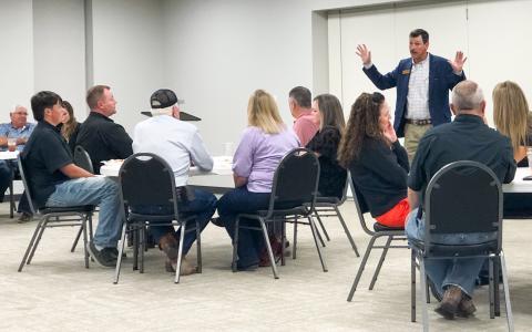 Addressing the small crowd at the Collingsworth County Farm Bureau County Convention Wednesday, Oct. 22 at the Bura Handley Community Building, Texas Farm Bureau (TFB) District 1 Director Jared Blankenship describes how the TFB AGFUND provides a voice for rural America in both Austin and Washington, D.C. 