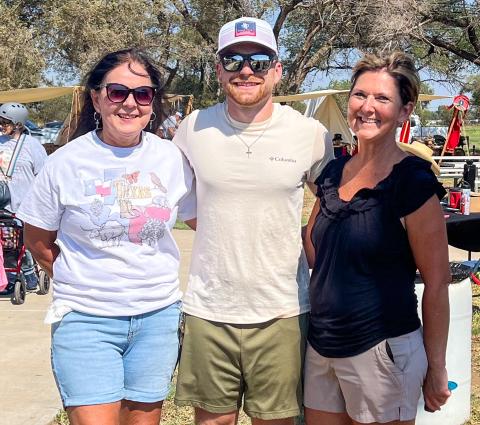 Wellington State Bank, represented by Odilia Cantu, left, Rowdy Duncan and Veronica Gray, receive first place in the Fifth Annual Rocky Sprott Living History Chili Cookoff.