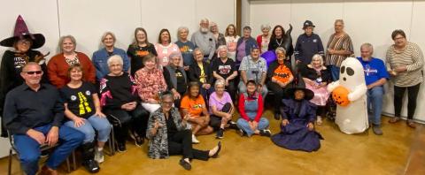 The membership of the Wellington Senior Citizens Center gathers Thursday evening, Oct. 23, for its October social within the Bura Handley Community Building. 