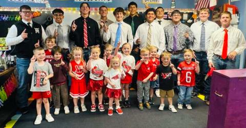 The varsity Wellington Skyrocket football team makes rounds at Wellington Elementary School, visiting with Megan Wisckaemper’s pre-kindergarten students, Friday morning, Sept. 26, prior to the Skyrockets’ home matchup against Panhandle, where Wellington took a 41-0 blank, falling in their first non-district loss of the season. 