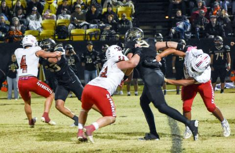 Fighting for the district championship title, Wellington’s Noah Cantu (4), Hunter Hedrick (52) and Elijah Granados (67) slow down the Wheeler Mustang offense for a Friday night, Oct. 31, where the Skyrockets fell 12-0 on the road. 