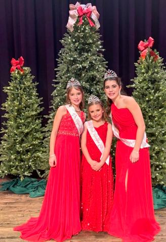 Junior Miss Wellington 2026 Peyton Roberson, left, Little Miss Wellington 2026 JoLee Breedlove and Teen Miss Wellington 2026 Quinn Roberson center the stage of the elegantly attired Wellington Ritz Theatre stage following the Sunday afternoon, Dec. 14 pageants.  