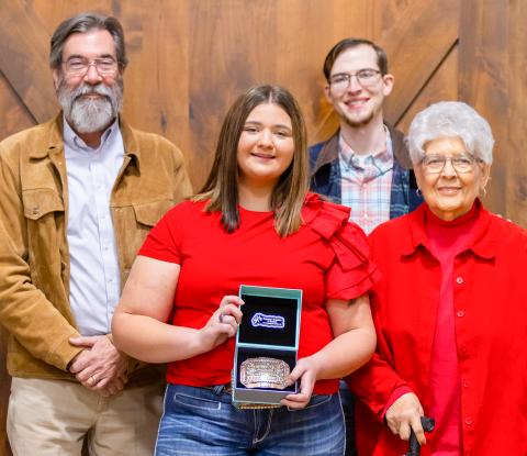 Wellington High School senior Jacy Lampe receives the Herdsmen Award in honor of the late Don Reeves during the Collingsworth County Livestock Association’s dinner and sale Saturday evening, Jan. 17 at the Bura Handley Community Center. From left: Wes Reeves, Jacy Lampe, John Reeves, Katherine Reeves. 